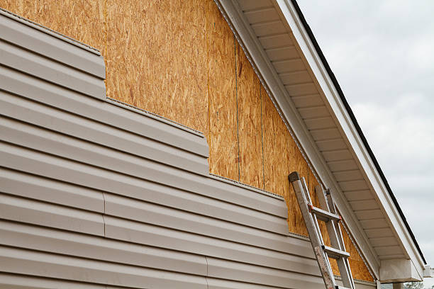 Professional Emergency Siding Repair technician working in Saint Paris, OH